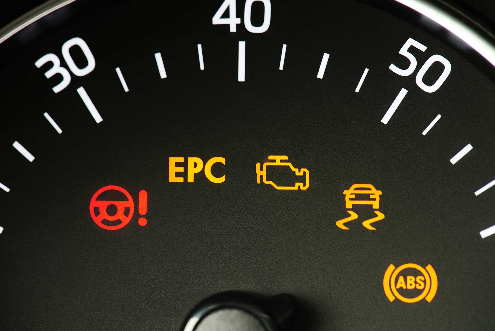 Car dashboard displaying various warning symbols | Parkville Auto Body